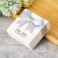 White textured jewelry box with a silver ribbon bow and printed decorative text - Grey Bow (Jewelry Model)