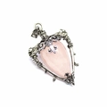 Detail of silver filigree pendant with heart-shaped pink stone and floral patterns - Rose Quartz