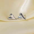 Polished silver heart stud earrings with an asymmetric elongated design on silk - Elongated Heart Stud (G3165)