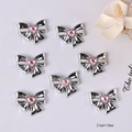 Detail van 21mm zilveren vlinderbedeltjes met roze hartvormige kristallen - Roze Diamant Strik Type 1 / 21mm*18mm