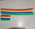 Set of 8 colorful sensory stretch tubes in four colors showing expanded and collapsed states - 1.9*11cm Medium Pop Tube