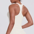 Detailed racerback design on cream workout tank top showing athletic fit and fabric texture - Light Ivory