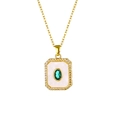 Detail of 18K gold plated necklace with white mother of pearl and green center gemstone - Oval Green Zirconia Necklace