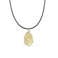 Macro detail of raw yellow citrine stone pendant with handcrafted gold wire wrapping - Citrine