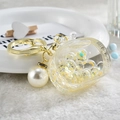 Acrylic moon bottle keychain with flowing liquid, yellow stars, beads and large pearl charm - Noctilucent TV Style / Lemon Yellow