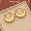 Macro view of gold croissant hoop earrings with ribbed texture on a jewelry display mat - Spiral Texture Style (11#)