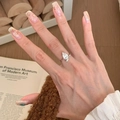 Elegant silver pear-cut gemstone ring with a stylish twisted band on female hand - J5741-Silver Twist Waterdrop Zircon