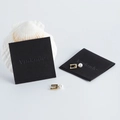 Golden geometric earrings with white pearls and black microfiber jewelry pouches - Black