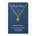 Detail of gold evil eye charm necklace presented on a blue symbolic card background - 18K Gold Yellow Bead (Black Eye)