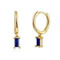 Detail of gold huggie earrings with a rectangular blue sapphire gemstone pendant - Gold + Blue Zirconia
