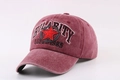 Close-up of vintage washed baseball cap with embroidery detail and curved visor - Burgundy