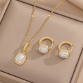 Golden necklace and earring set with square cat eye stones in a beige jewelry box - Necklace and Earrings Set (851 Set)