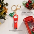 Detailed size and weight view of a Christmas stocking nail clipper keychain with a 3D tree - Christmas Mittens