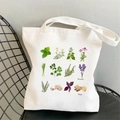 White canvas tote bag featuring twelve vintage botanical herb illustrations and long straps - STD704-A Herb Plants