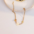 Elegant 18k gold plated bracelet featuring a letter A pendant and clover charm with beads - Letter A Round Tag Bracelet