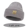 Light gray knit beanie for kids with a golden happy face patch and rolled cuff - S (6-36 Months) / Gray
