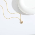 Vintage golden Evil Eye necklace featuring a round pendant with white zircon accents - Eye