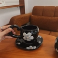 Handcrafted black ceramic coffee cup and saucer set with painted floral patterns - Black with Large Petals Cup & Saucer Set / Cup + Saucer Set