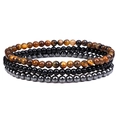 Detail van de 3-delige set met tijgeroog, agaat en hematiet 4mm kralenarmbanden - Gele Tijgeroog