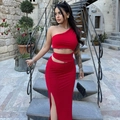 Detail of red one-shoulder cut-out dress with high-slit skirt and ruched fabric texture - S / Red
