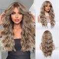 Detail showing wavy texture and French bangs of this long ash blonde synthetic wig - Gold Brown