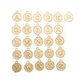 Flat lay of 26 gold alloy alphabet pendants from A to Z for DIY jewelry making - KC Gold
