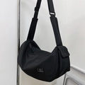 Black nylon gym bag with wide shoulder strap and functional multi-pocket design - Black