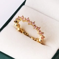 Detail of gold-plated open ring with wavy band and pink pavé cubic zirconia - Adjustable Open / Pink Zirconia (Gold)