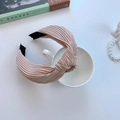 Champagne pleated headband with elegant top knot design displayed on a white cup - Pleated Knot Pink (FK-B107 Pink)
