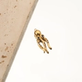 Detailed macro view of an 18K gold-plated octopus pendant with blue gemstone eyes - 1# Octopus Blue Zircon