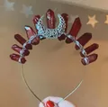 Detail view of handmade moon headband with deep red crystals and silver wire wrap - White K Headband/Moon/Dark Red Crystal