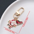 Christmas keychain with Santa Claus and red ice skate enamel pendants in gold finish - ER837-Enamel Santa Skating Ice Skate U-shaped Keychain