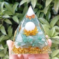 8cm Orgone Pyramid with green crystals, golden lotus, and white orb held in hand - 8cm / White Ball Green Aventurine