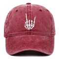 Detail of white bone rock hand gesture embroidery on washed red cotton baseball cap - One Size / Burgundy