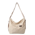 Sac bandoulière en velours côtelé beige avec sangle réglable et poche avant sur fond blanc - Blanc Cassé