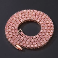 Detail view of pink rhinestone tennis chain necklace with rose gold plating on black background - Rose Gold Pink Rhinestone 5mm
