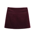 Detail showing the burgundy corduroy fabric texture and back pocket design of the mini skirt - XS / Burgundy