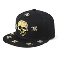 Hip hop snapback hat featuring a 3D gold metal skull emblem and decorative flat brim studs - Black