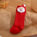 Detail of red Christmas sock with Santa Claus plush figure on burlap background - L 1-3 Years Old / Red-Bearded Santa