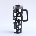 Detail of 40oz black tumbler with white polar bear and snowflake winter pattern - Black Winter Polar Bear
