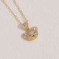 Golden bear pendant necklace featuring pave-set white zircons and black gemstone eyes - 14K Gold White Zircon