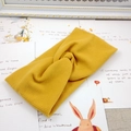 Knitted ribbed twist headband for children in yellow, minimalist stretch hair accessory - Turmeric