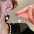 Silver snowflake earrings with zircon and pearl charm, shown on model and hand - Silver Post Earrings (Silver Snowflake Style)