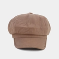 Close-up of brown octagonal newsboy cap showing cotton texture and top button detail - Dark Khaki
