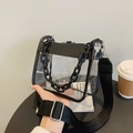 Clear PVC crossbody bag with black trim and dual chain fabric shoulder straps - Black