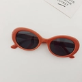 Kids vintage oval sunglasses featuring orange frames and dark lenses on a white background - Orange