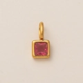 Detail of 18K gold square pendant featuring a deep pink gemstone on textured surface - July Birthstone Pendant / Gold