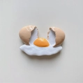 3D resin fridge magnet featuring a realistic broken egg design with yolk and shell - Cracked Flowing Egg