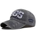 Grey vintage washed cotton baseball cap with 1985 embroidery and distressed brim details - Gray