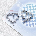 Macro view of silver alloy heart pendants with dimensions 25mm by 24mm and pearl detail - 32# Silver Fluid Pearl Heart